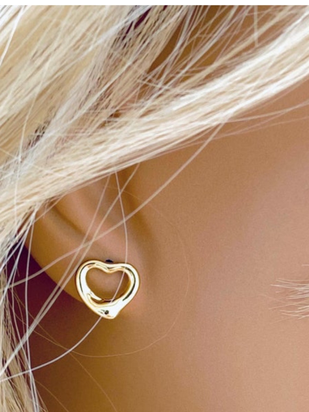 Tiffany & Co. Elsa Peretti Open Heart Silver Stud Earrings.